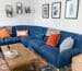 brown wooden coffee table beside blue couch