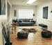 black leather sofa near brown wooden coffee table